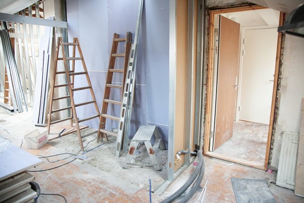 home renovation construction with ladders and drywall dust